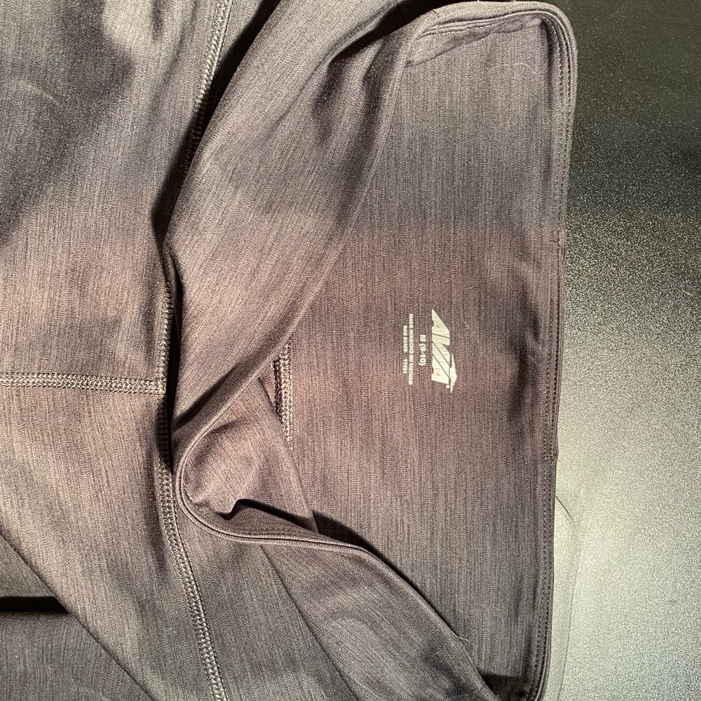 AVIA size medium. Grey and black tones.